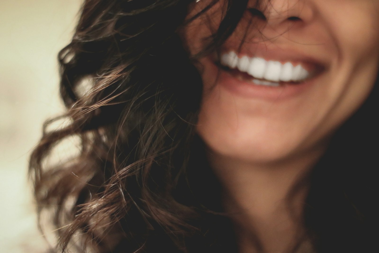 Long black haired woman smiling close-up photography